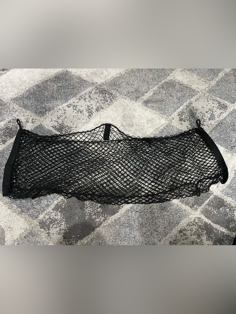 Kia trunk cargo net measured at approximately 33 inches wide